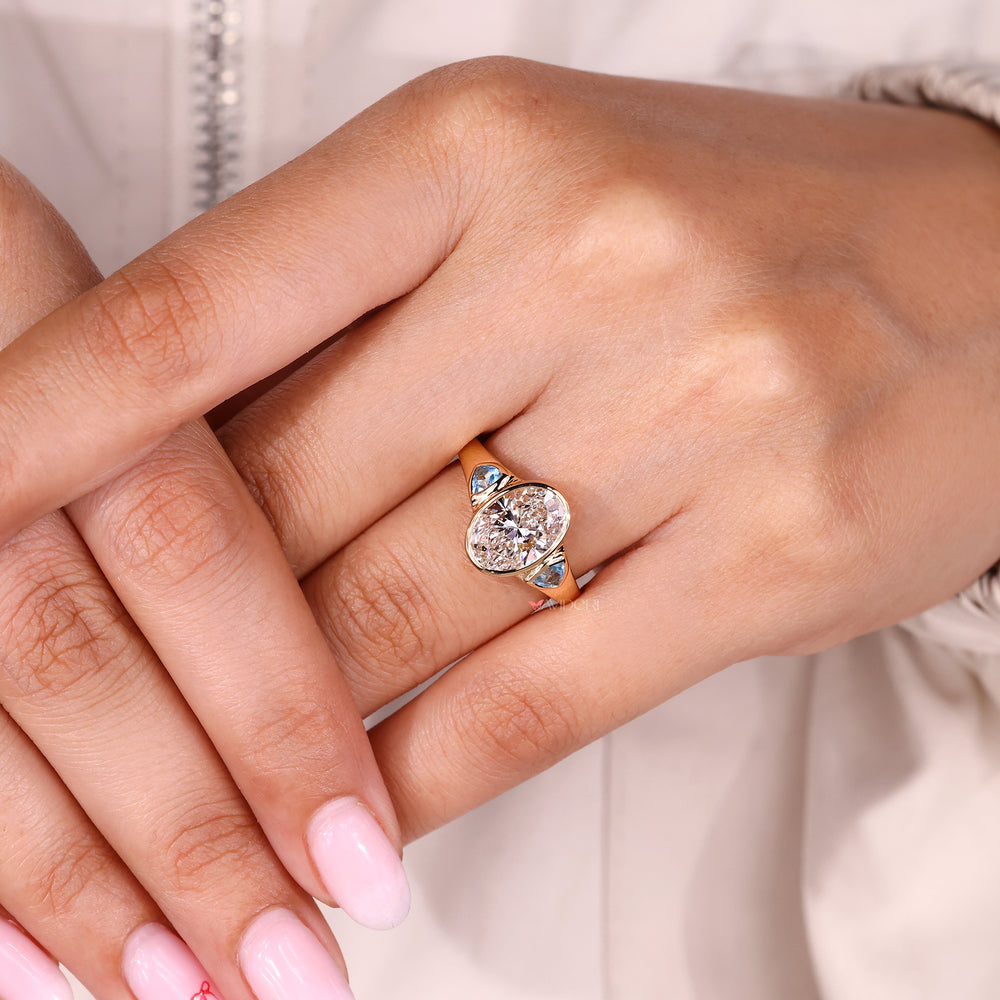 Buy engagement ring with bezel set oval diamond.