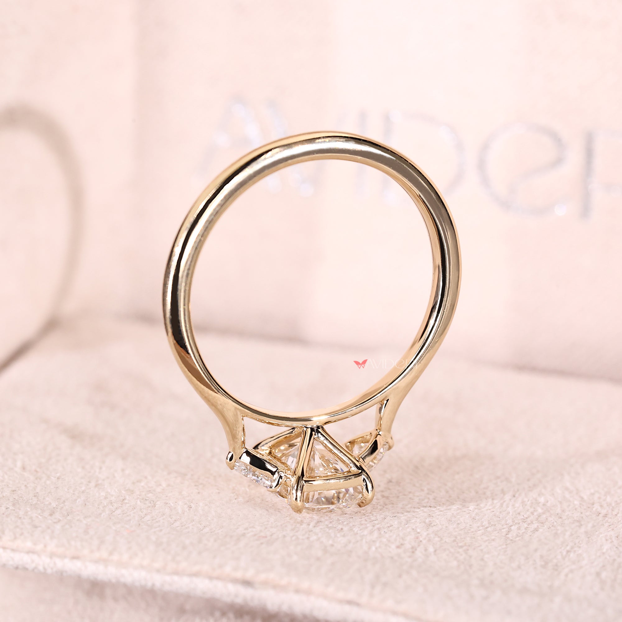 Cathedral setting three stone engagement ring.