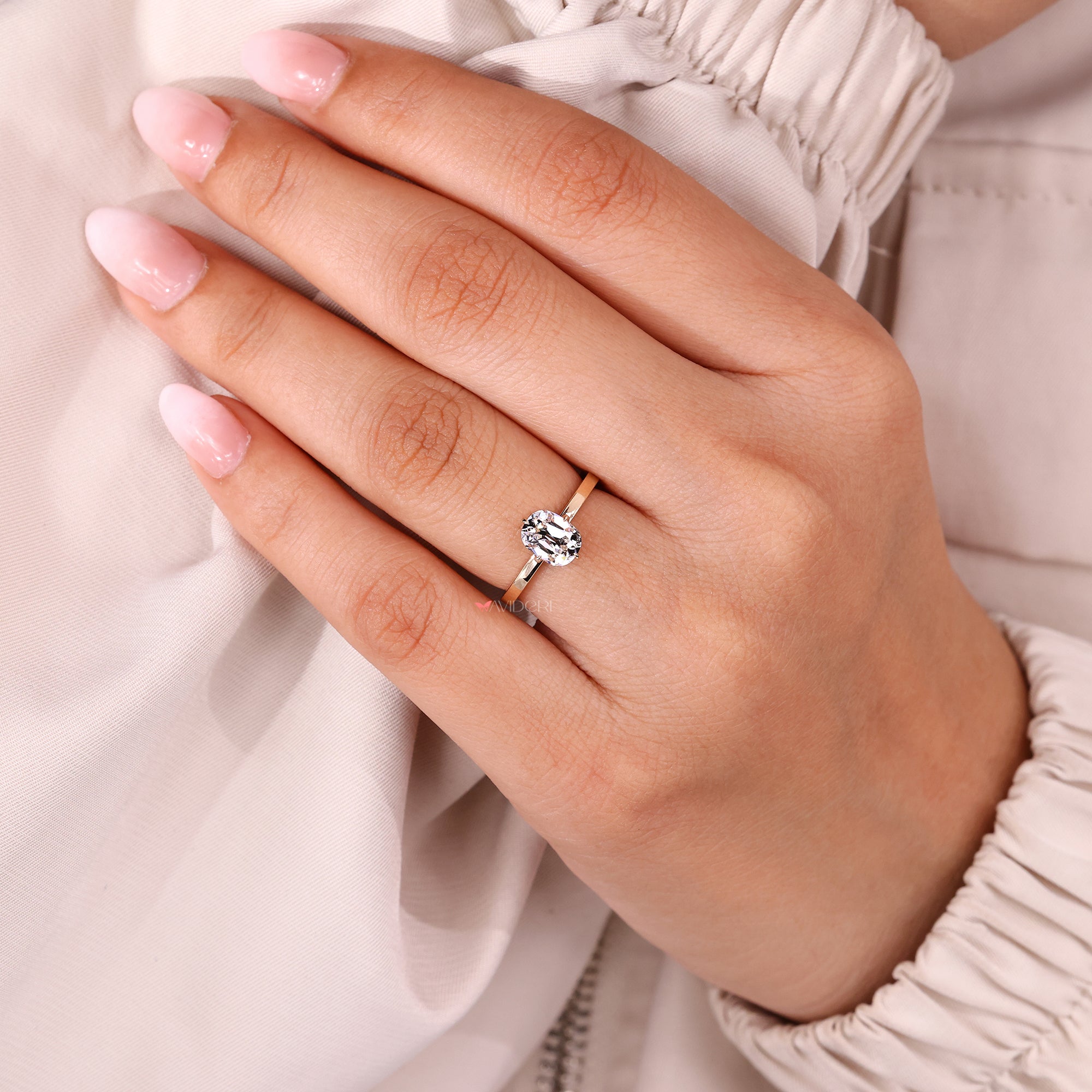 Compass prong setting diamond ring in rose gold.