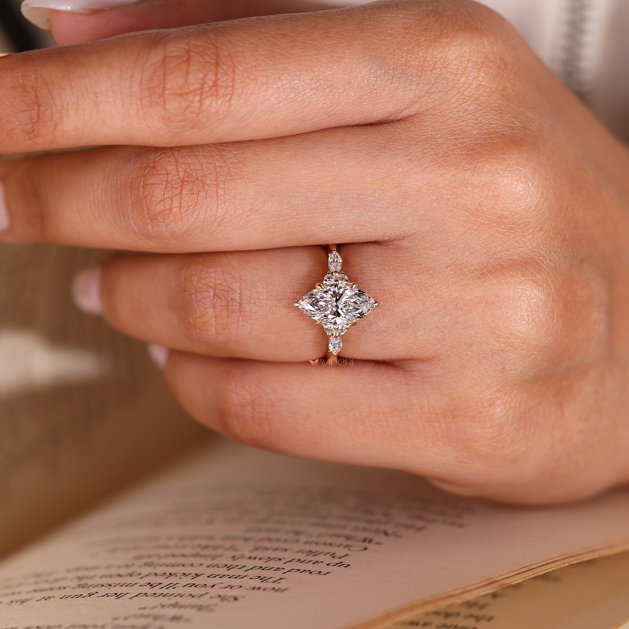 Marquise diamond ring with round and marquise accents.
