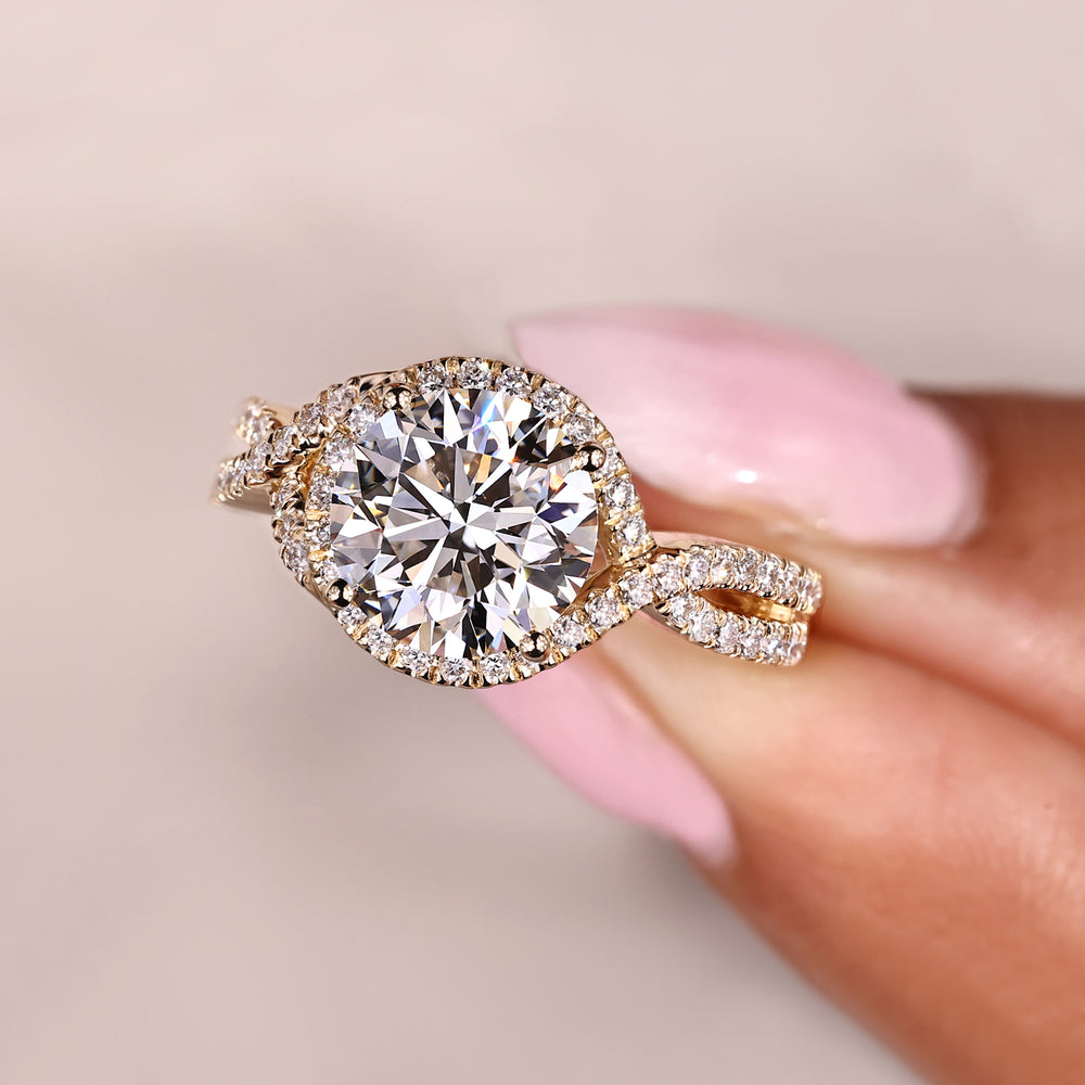 Twisted shank engagement ring with round diamond halo.