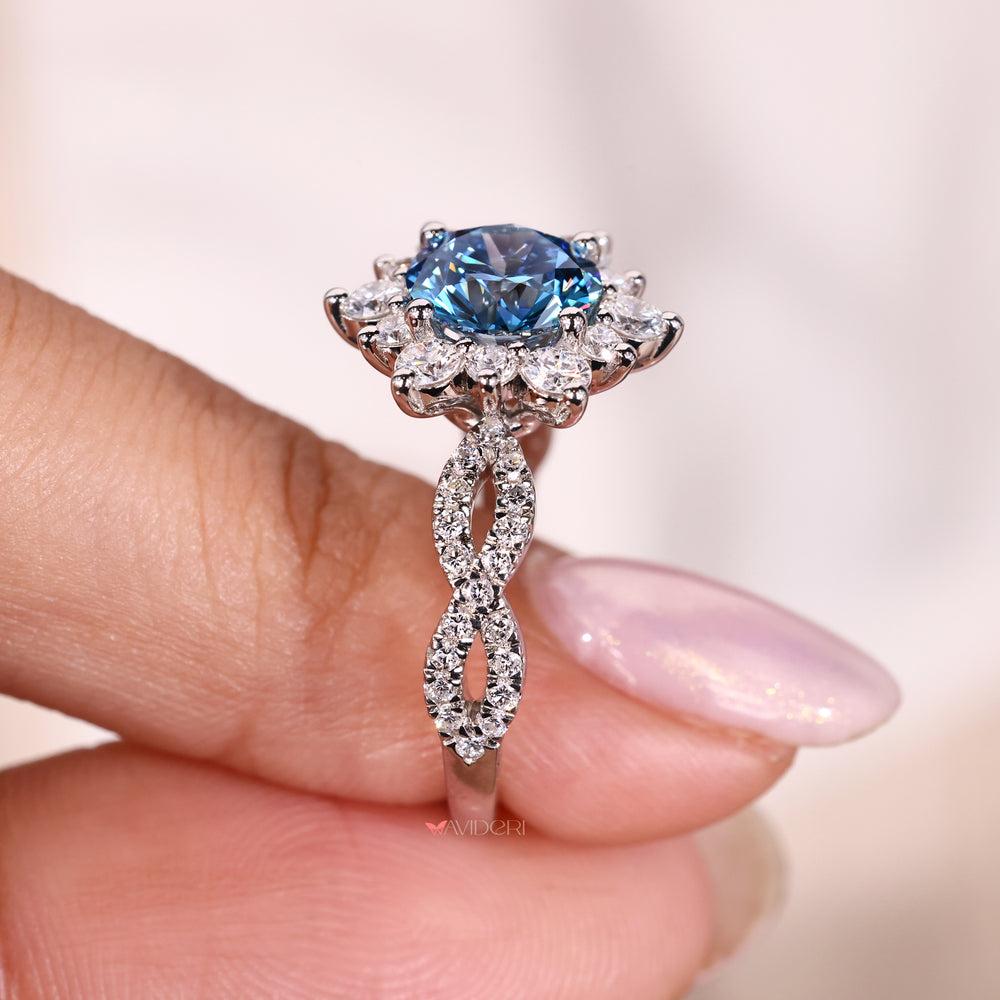 round diamond cluster engagement ring with prong setting and twisted pave band.