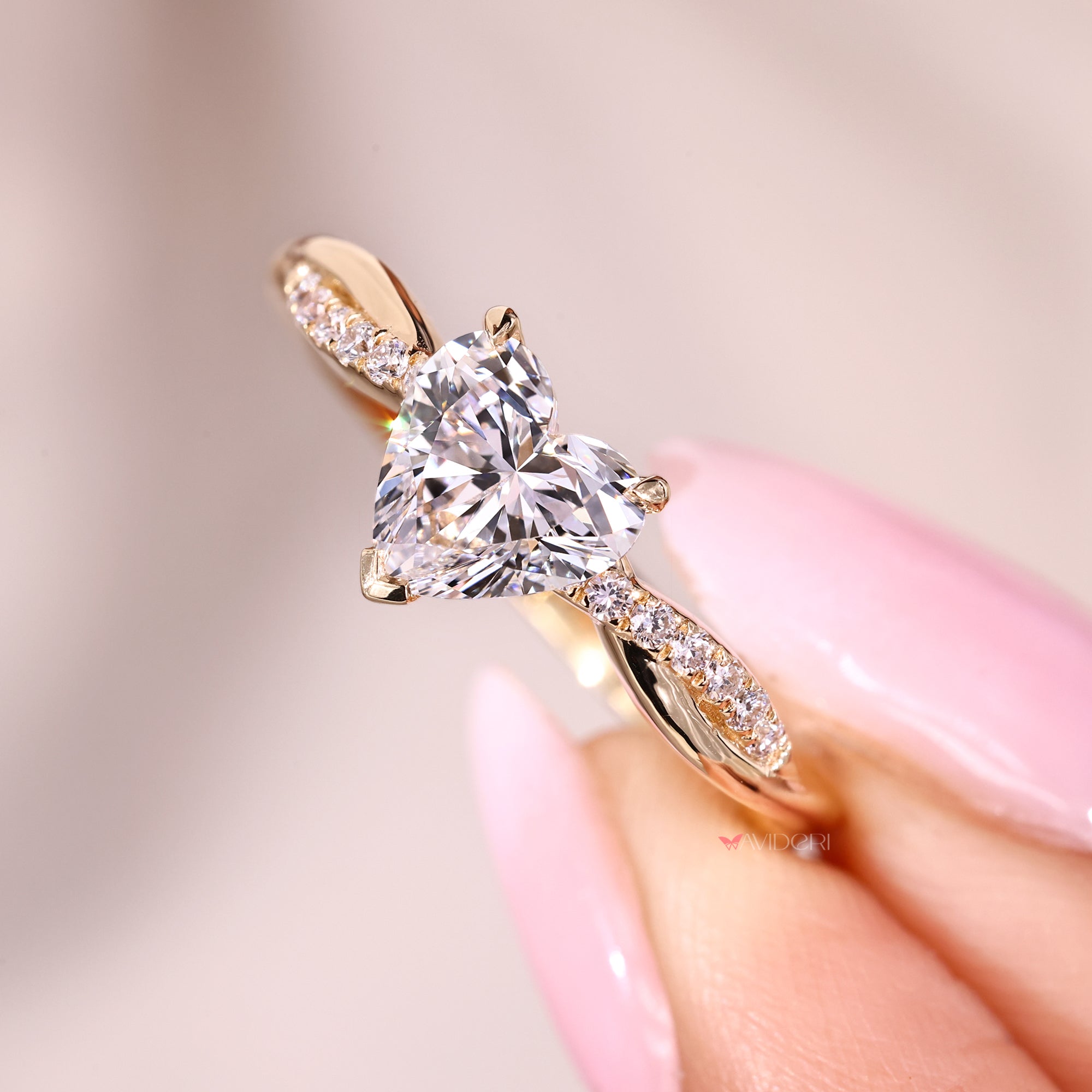 Custom diamond ring with heart cut stone.
