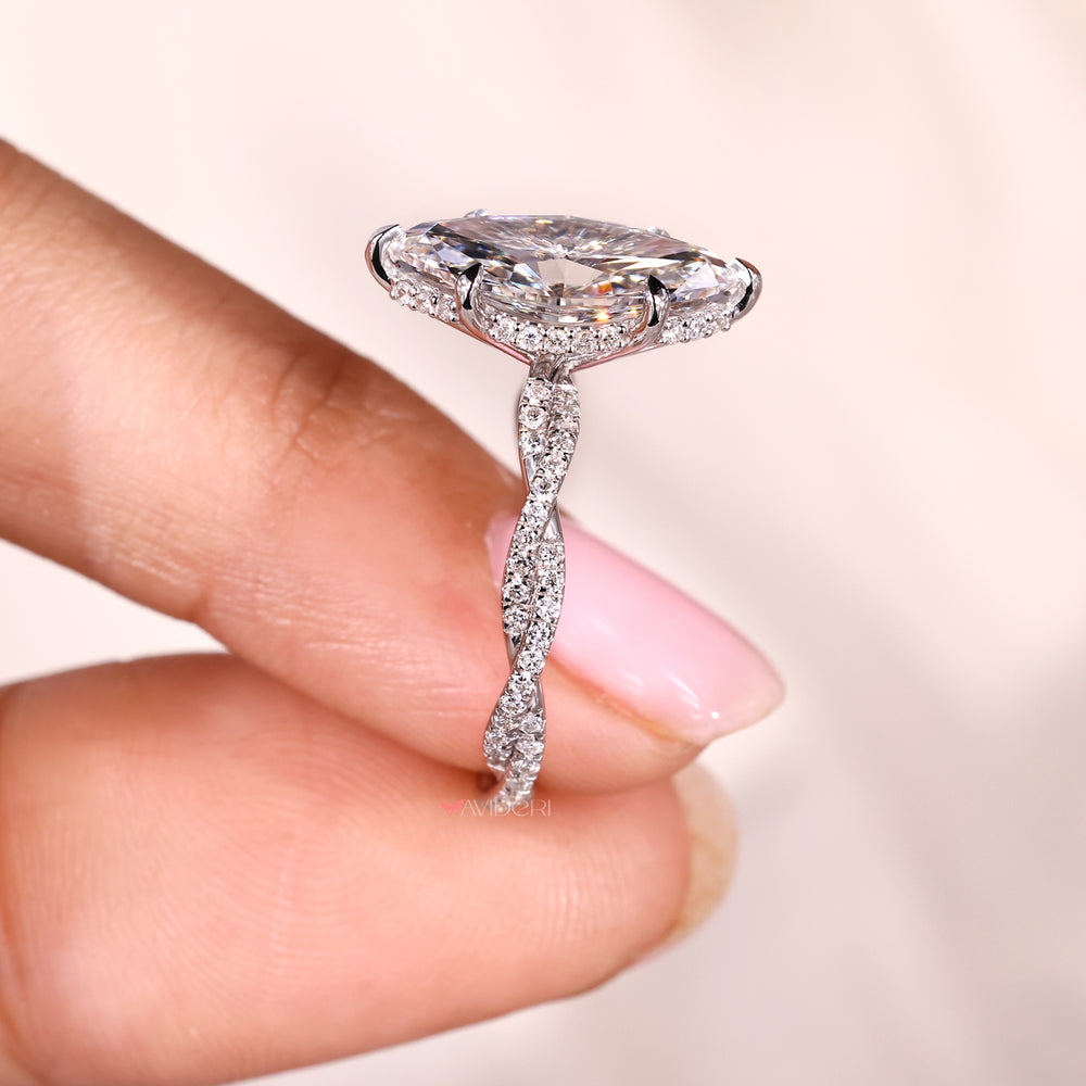 Hidden halo engagement ring with six claw prong setting.