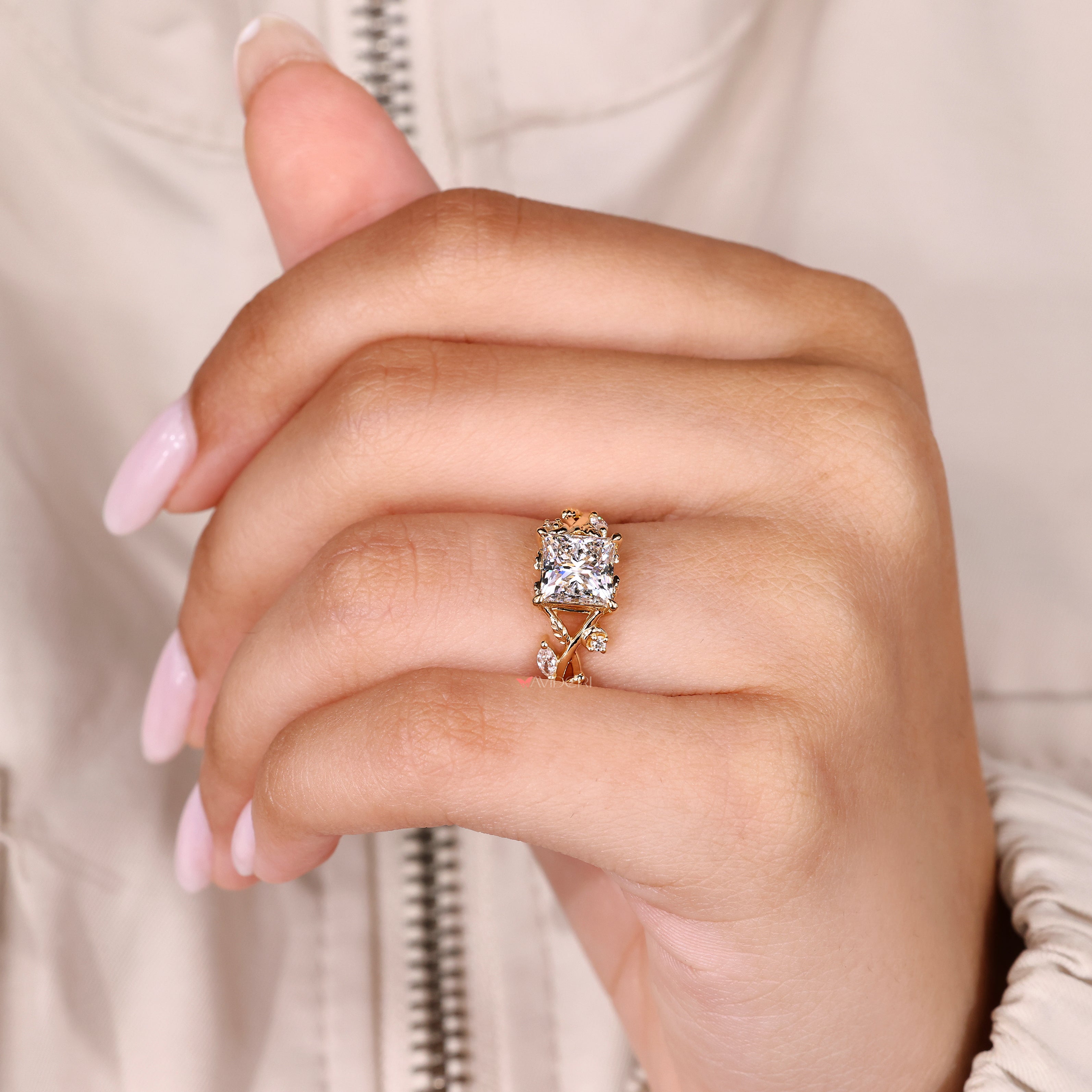 Princess ring with cathedral setting and prongs.
