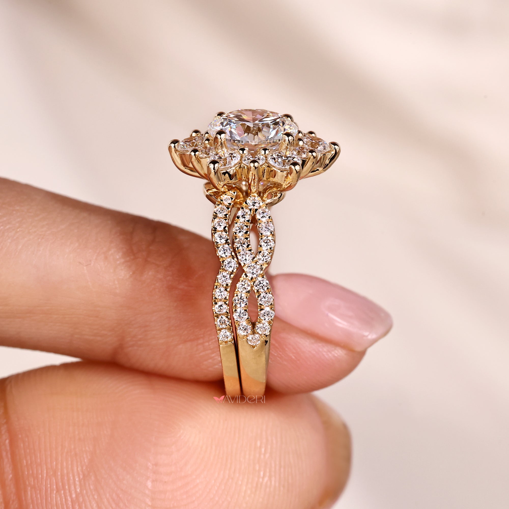 Twisted shank ring with halo setting ring.