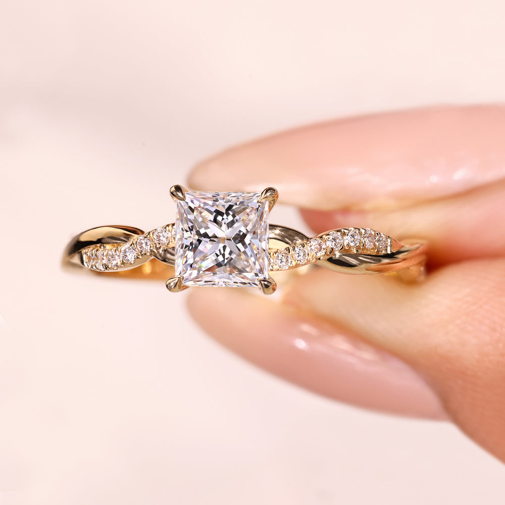 Princess cut engagement ring with pave round diamond band
