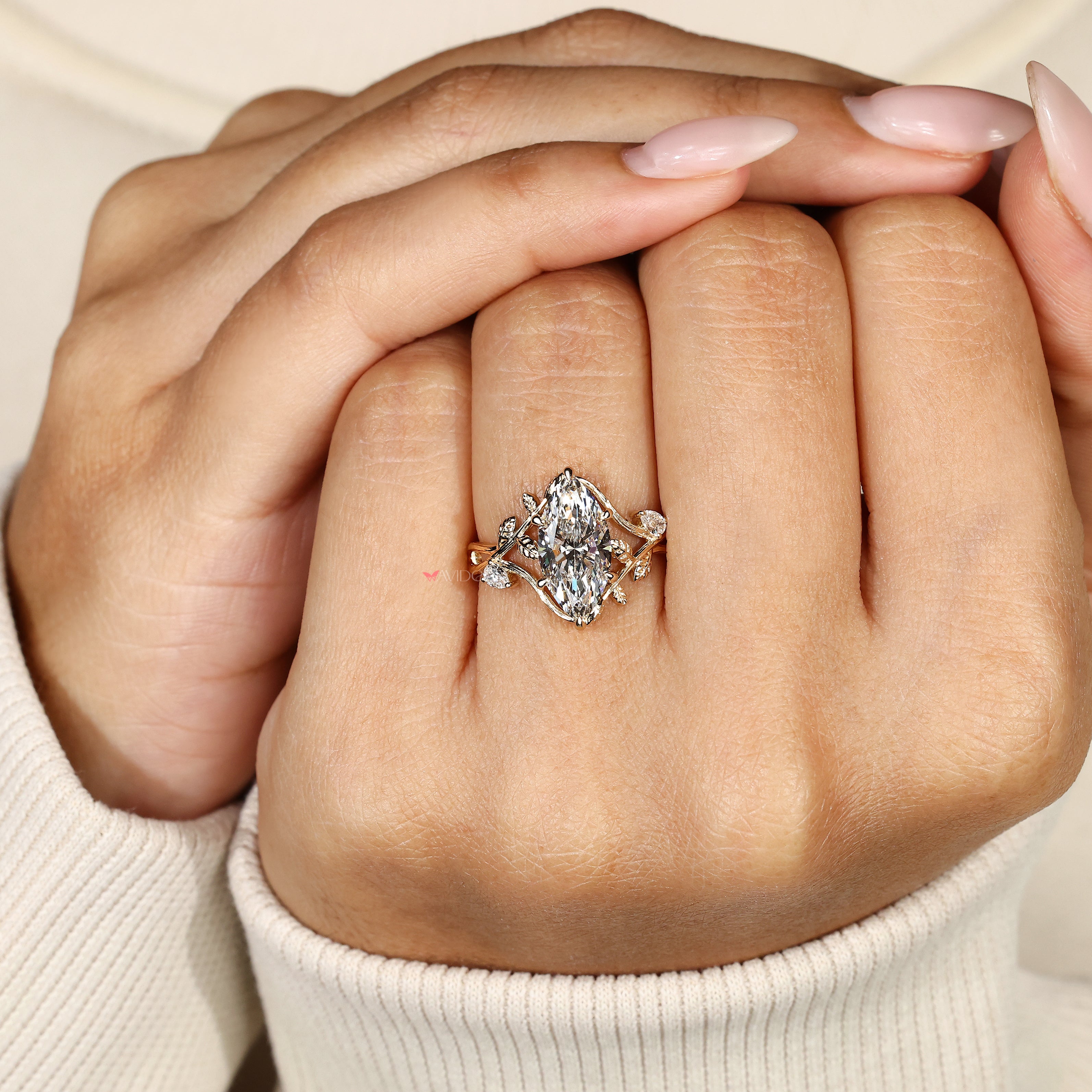 Handmade botanical engagement ring with pear side stone accents
