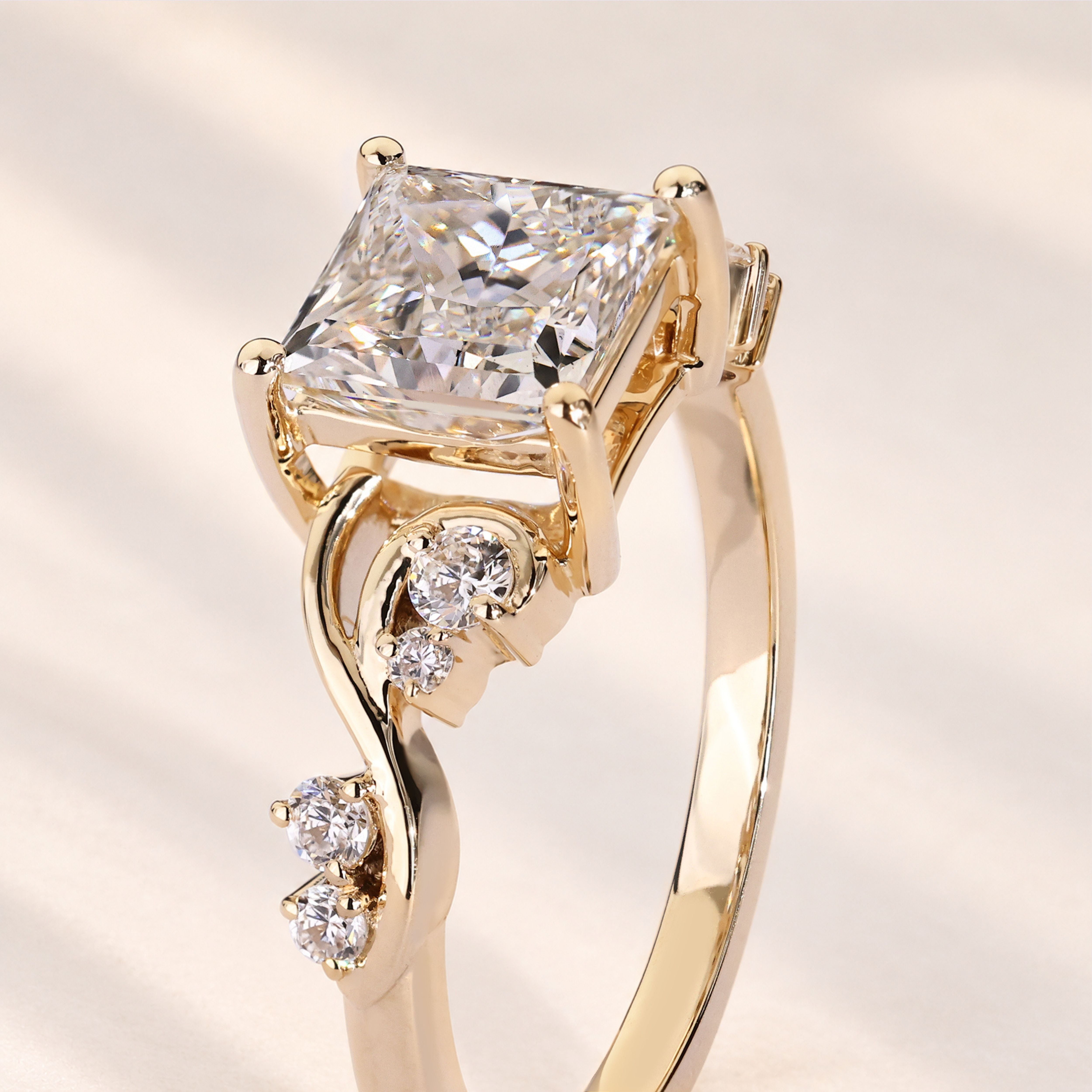 Princess cut diamond ring with round side diamonds.
