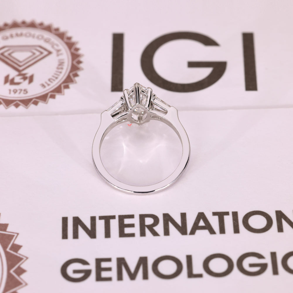 Handmade marquise ring with baguette side stones.

