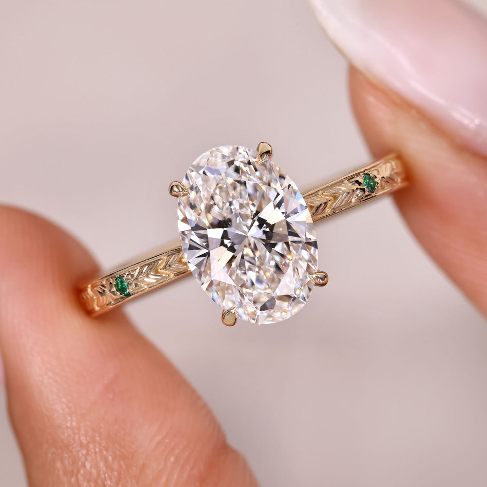 Cathedral style oval diamond ring with side stones.
