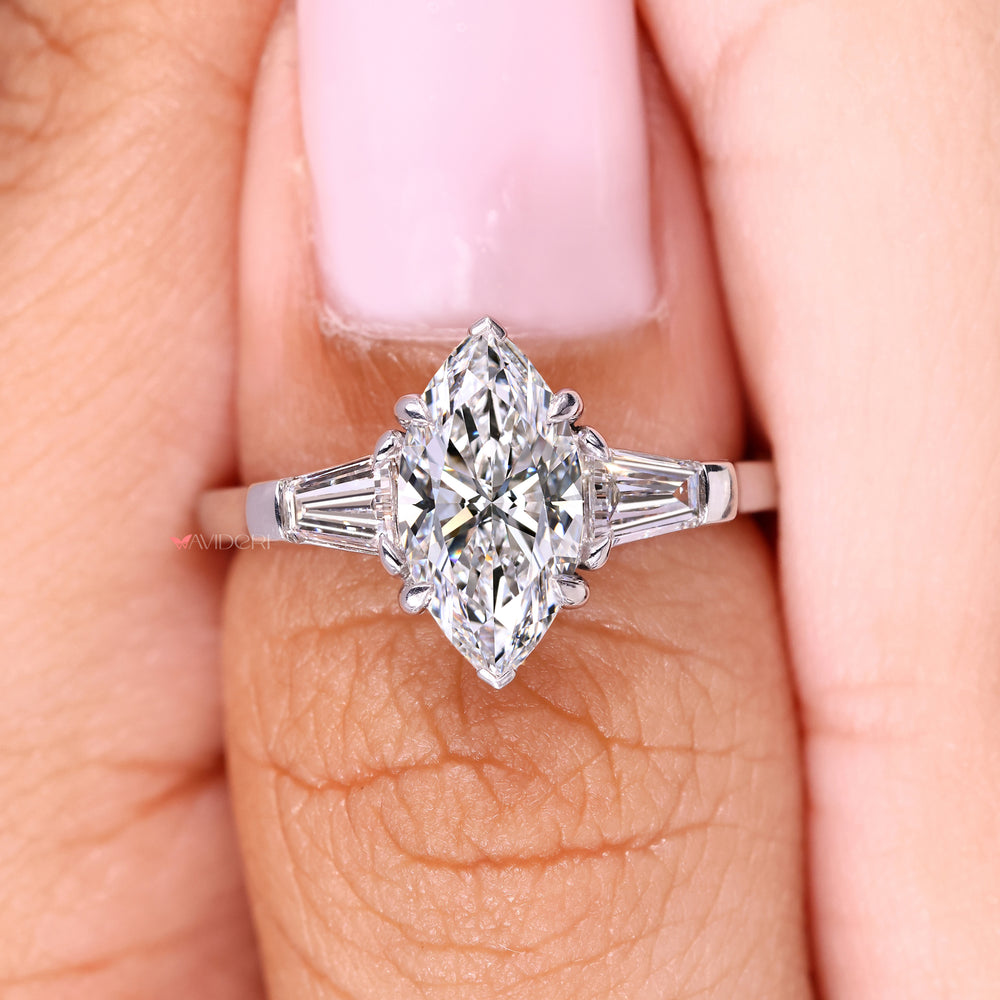 Handmade marquise ring with three stone style.
