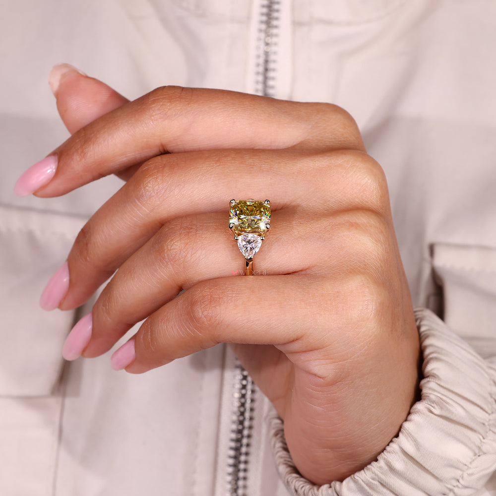Cushion cut moissanite ring with trillion side stones.
