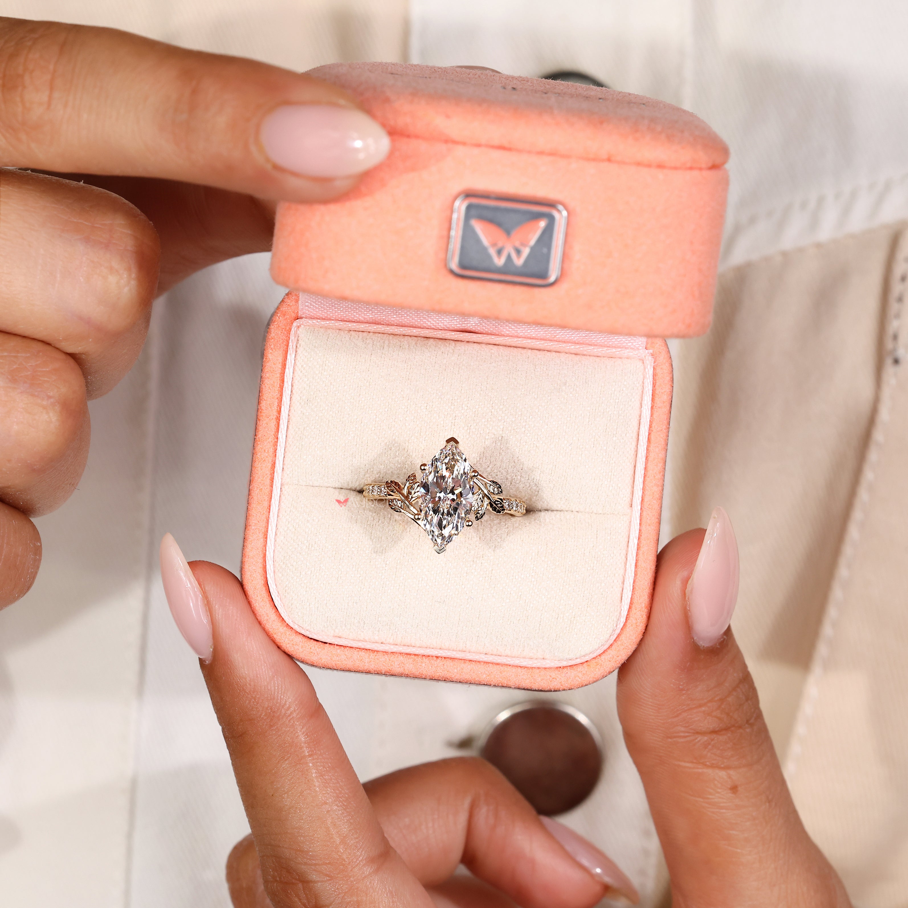 IGI certified marquise diamond ring with basket setting details
