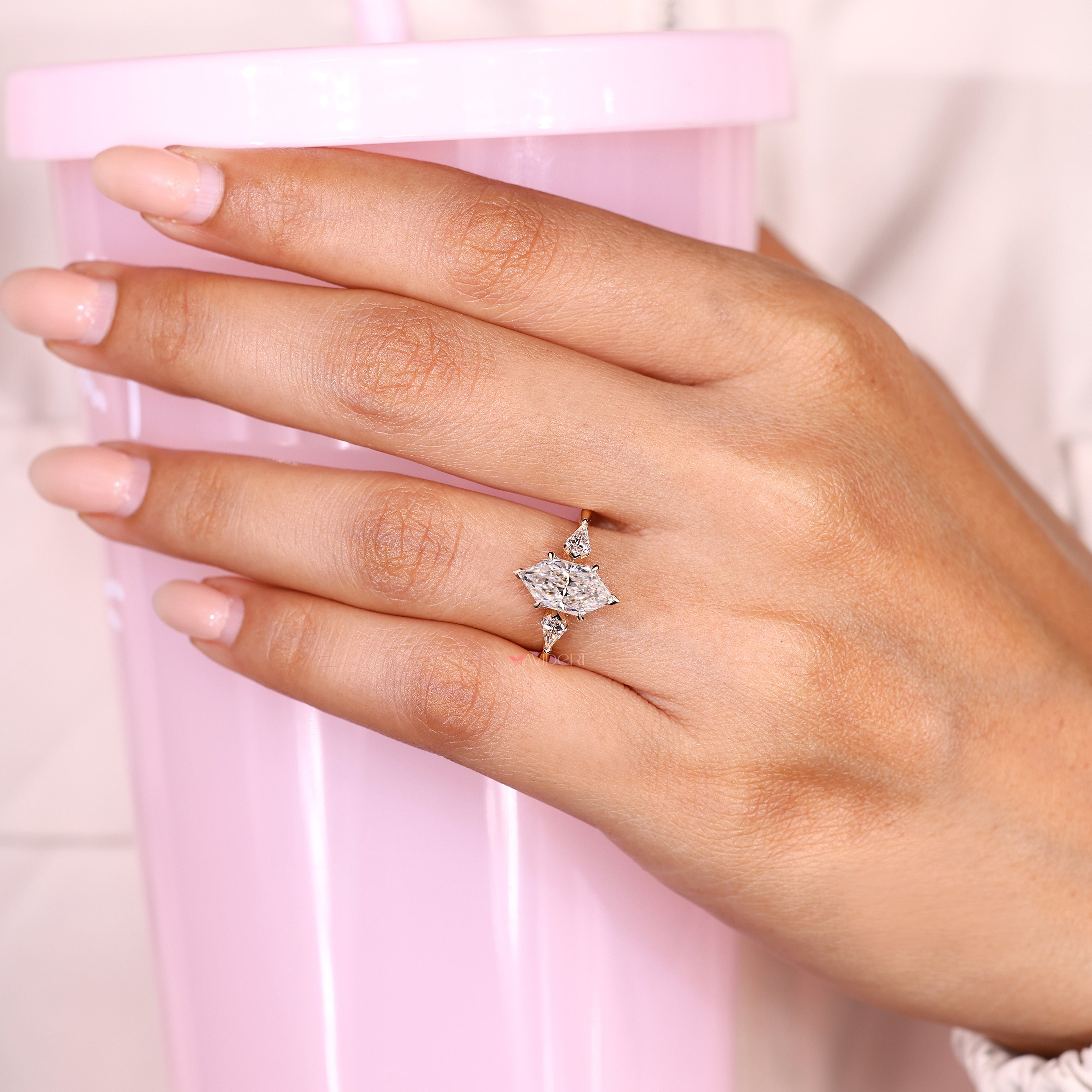 Three stone Dutch marquise ring with tulip setting details
