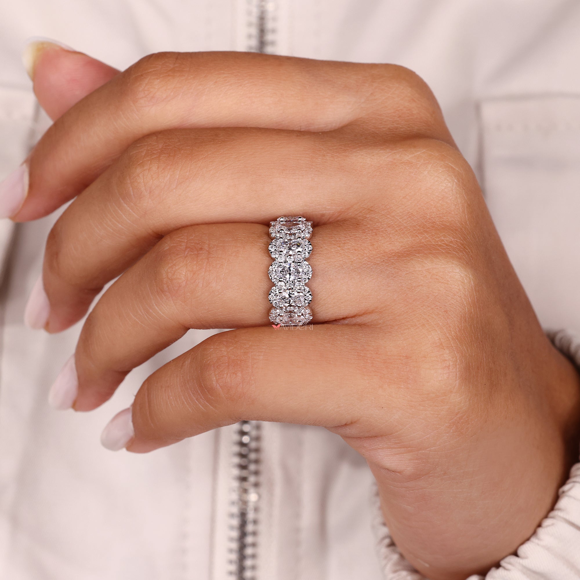 Round halo eternity band in white gold.