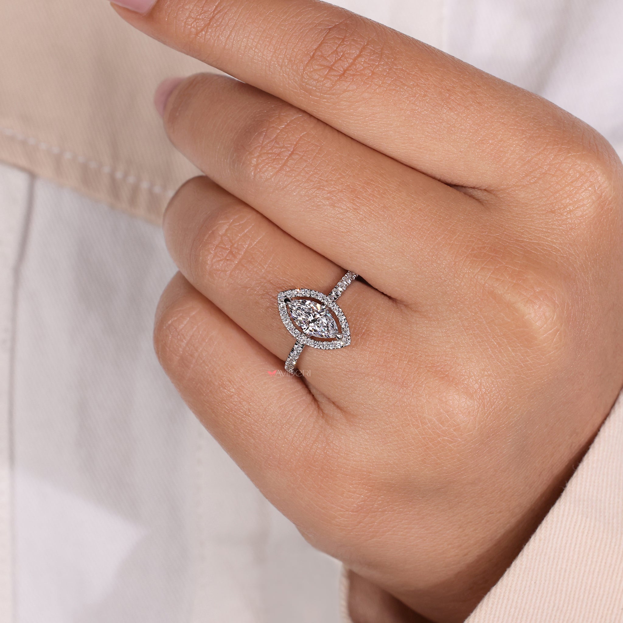 Pave band engagement ring featuring a marquise halo diamond, blending contemporary style with traditional charm.
