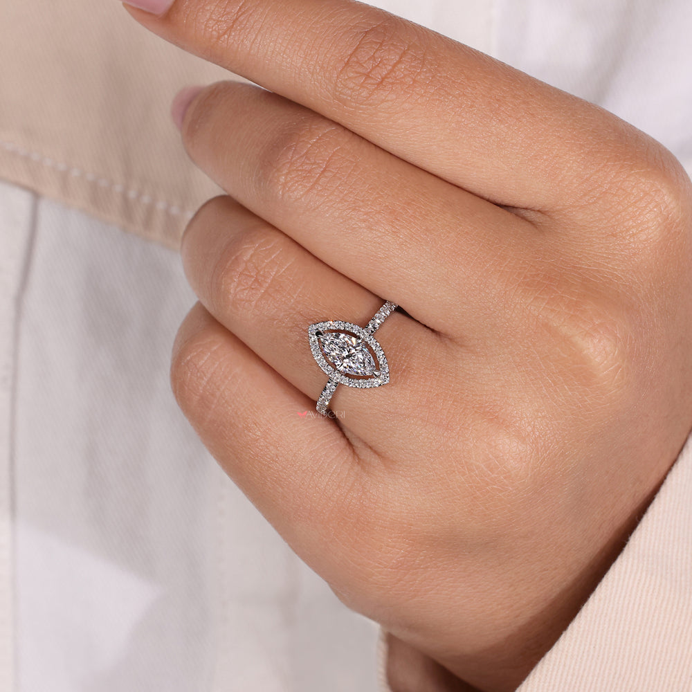 Pave band engagement ring featuring a marquise halo diamond, blending contemporary style with traditional charm.
