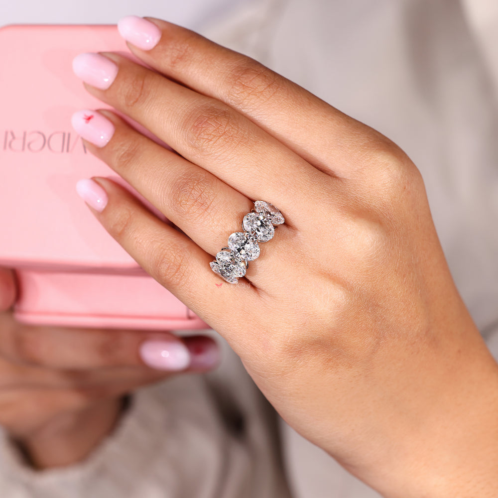 Five stone wedding band with oval cut diamonds.