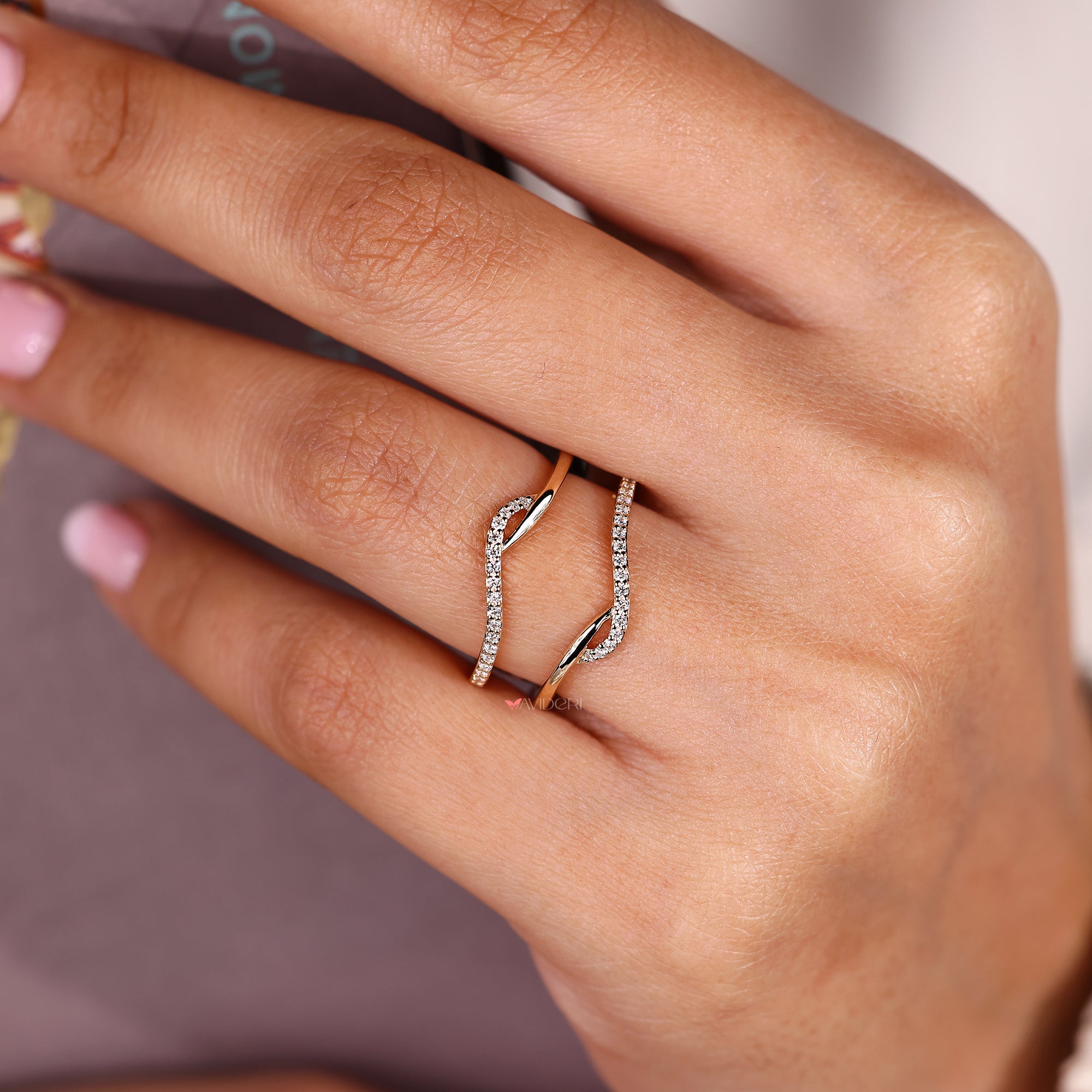 Diamond wedding band with a wrap guard style.