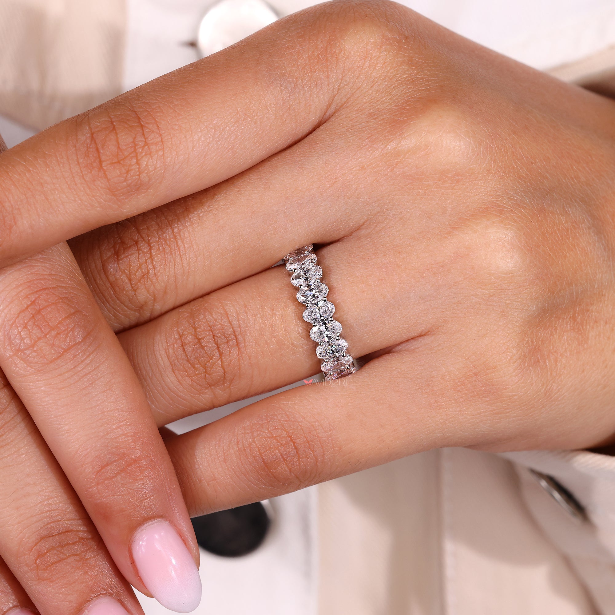 Handmade band with oval diamond setting.