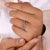 Round diamond wedding band with timeless sparkle.
