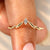 Marquise cut diamond wedding band with curved design.

