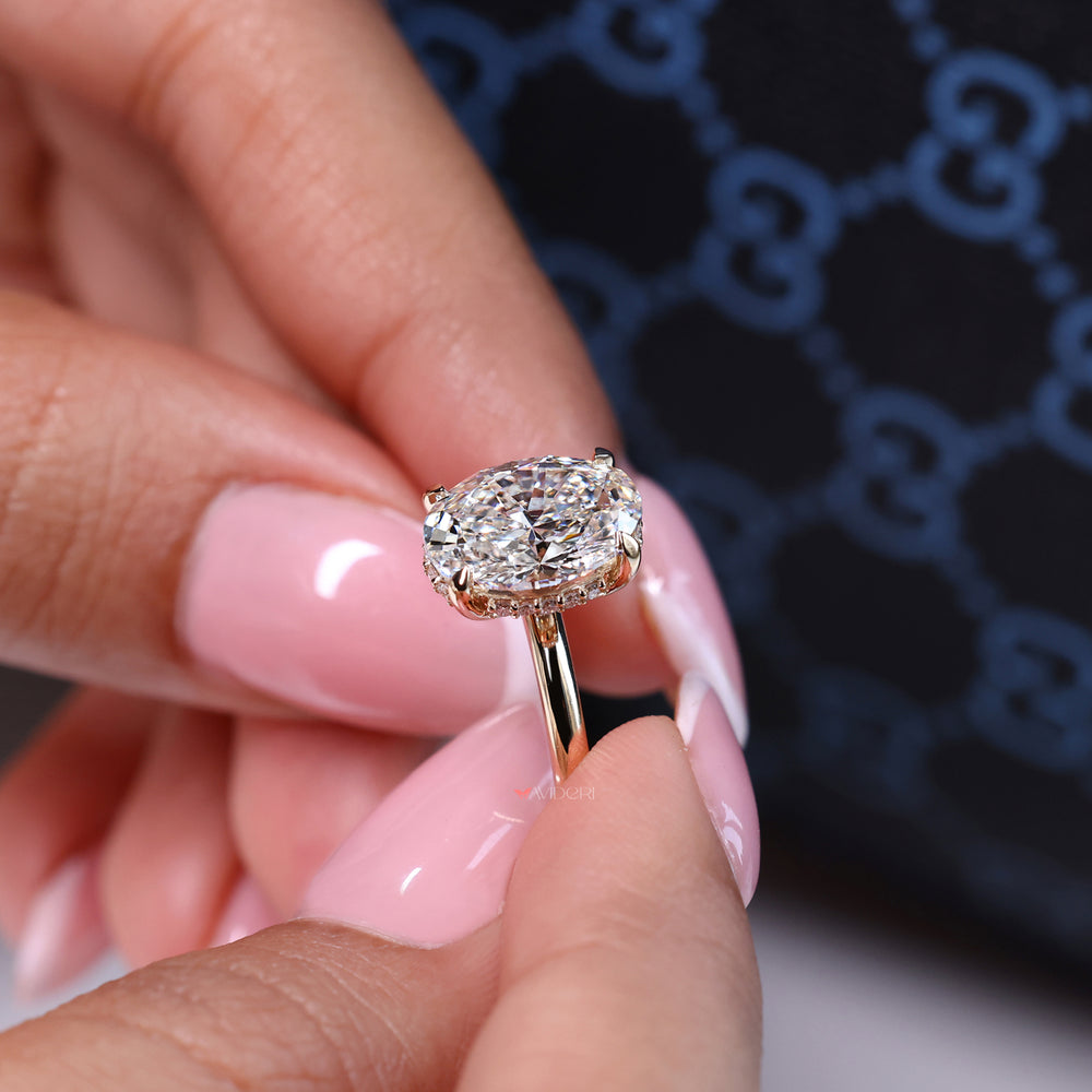 Oval engagement ring designed with a round brilliant cut ring for extra brilliance.
