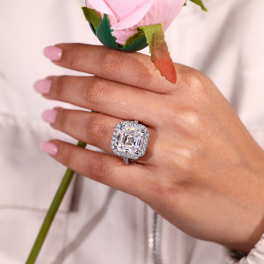 Moissanite halo ring with Asscher cut center stone.