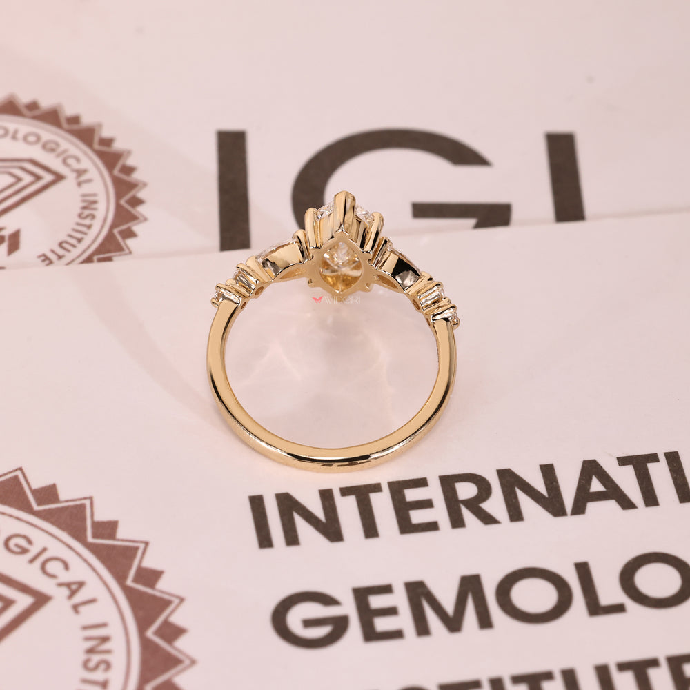Handmade marquise ring with pave side stones.

