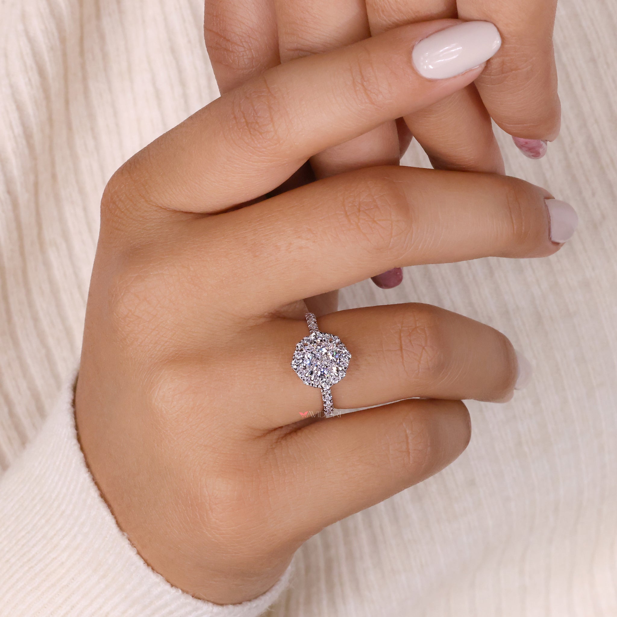 Cushion cut halo design crafted with precision, highlighting the timeless beauty of the diamond with a sparkling setting.

