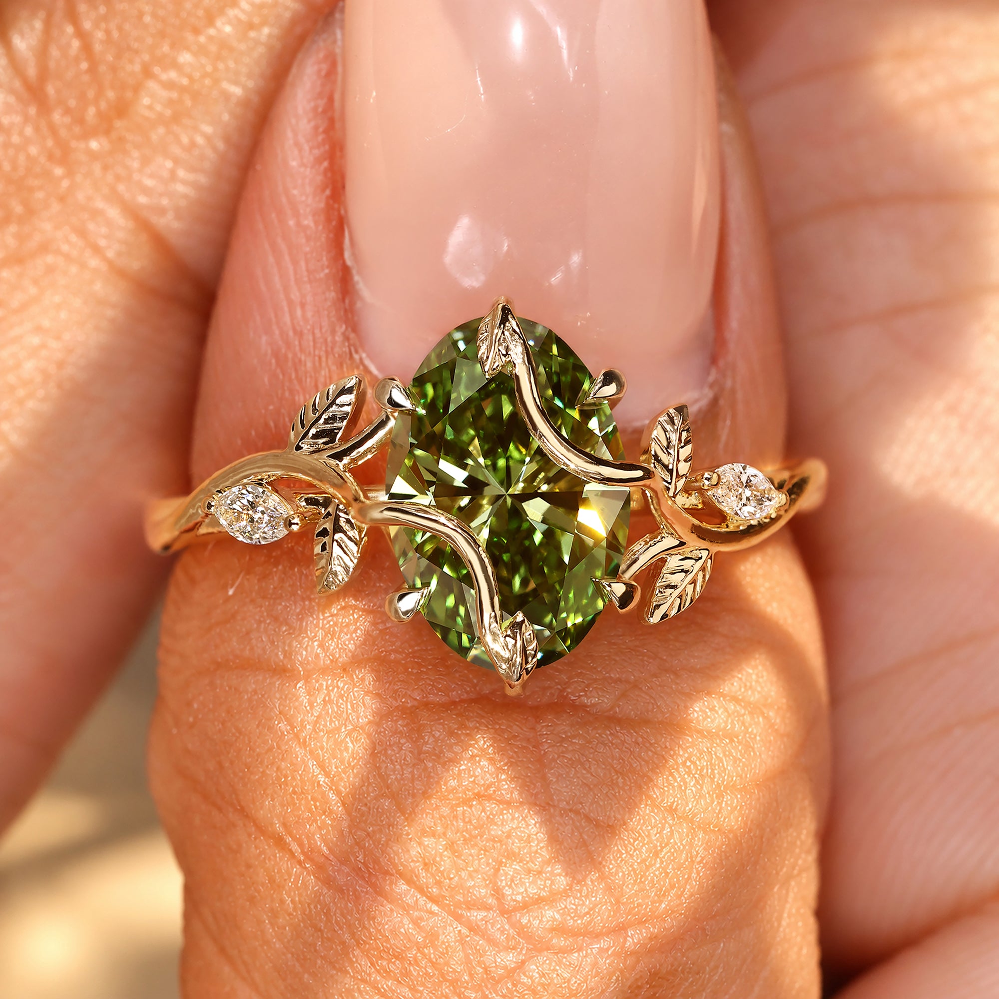 Oval engagement ring with round diamond side stones.