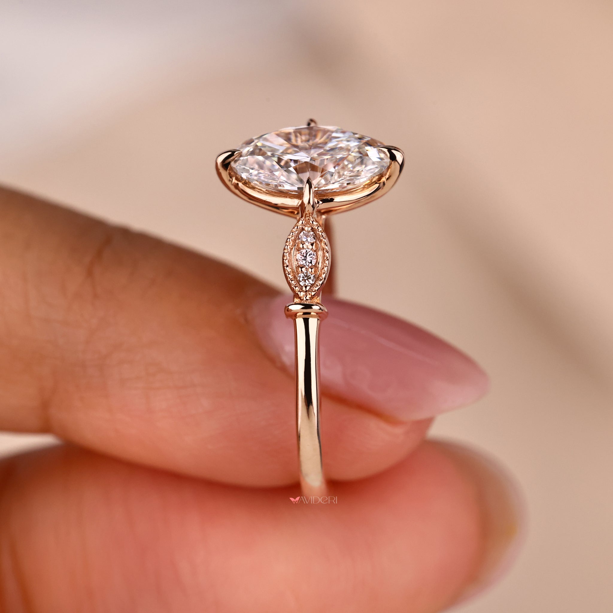 Avideri ring with round brilliant cut diamond and Lab Grown Diamond in a milgrain engagement ring style.
