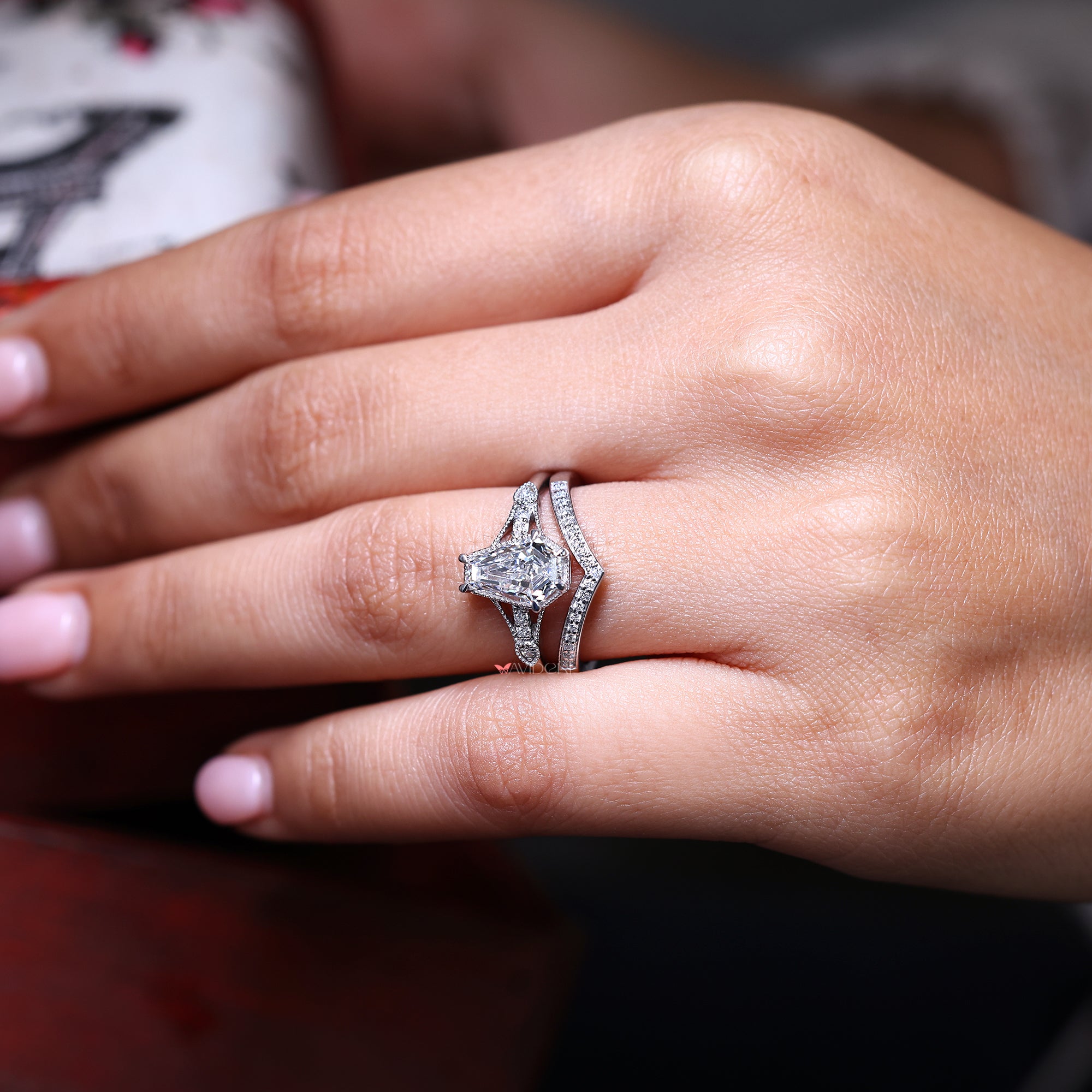 Coffin cut ring paired with round diamond wedding band in white gold.