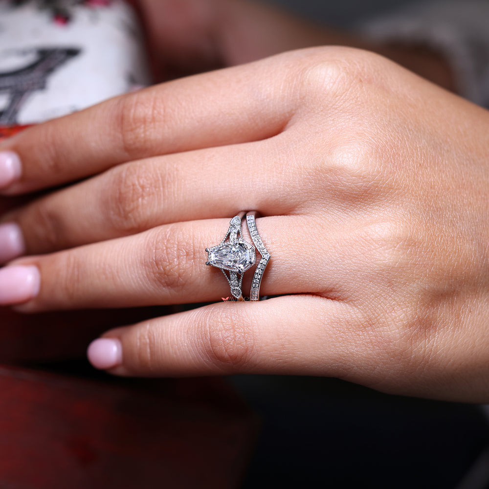 Coffin cut ring paired with round diamond wedding band in white gold.