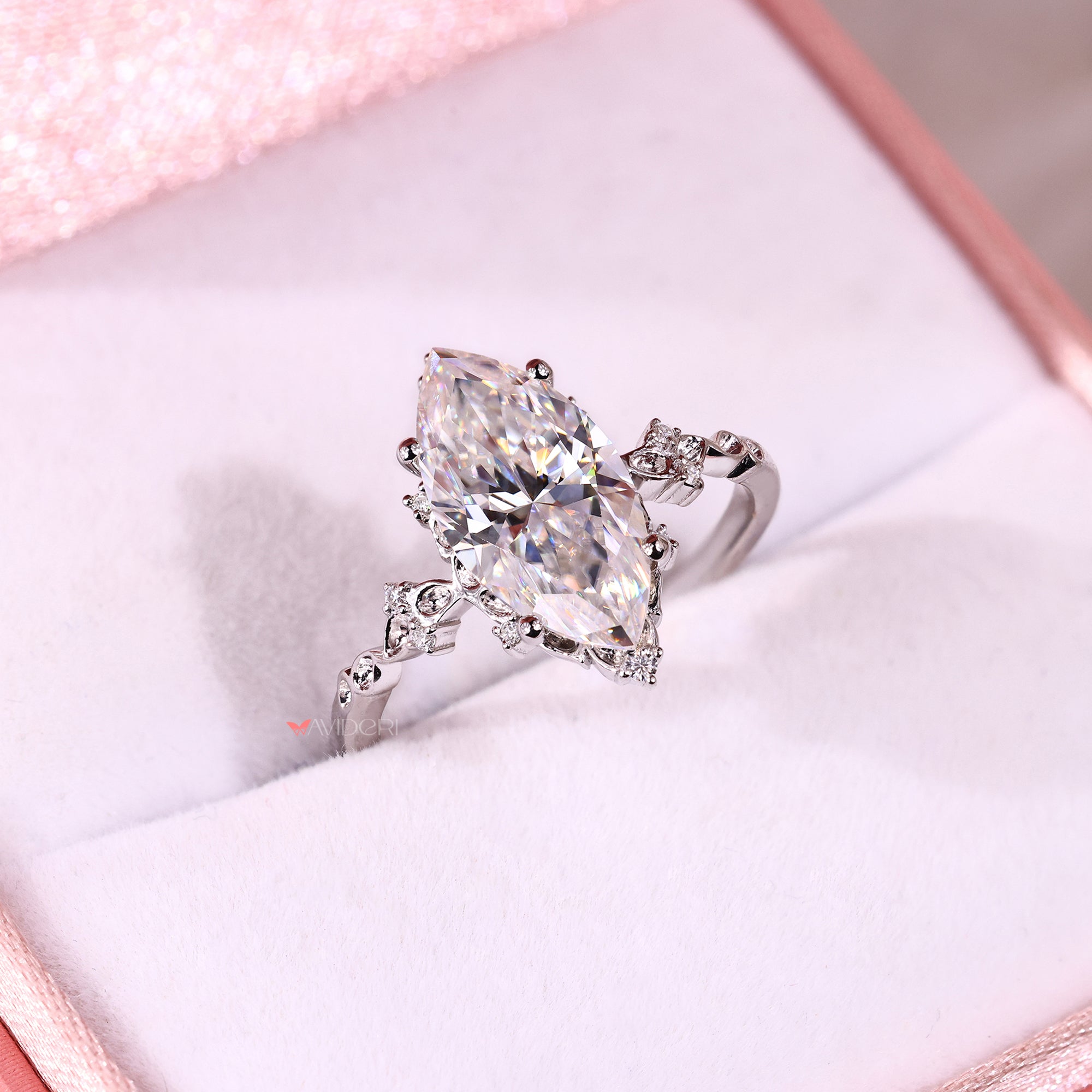 Buy engagement ring featuring a marquise moissanite center design.