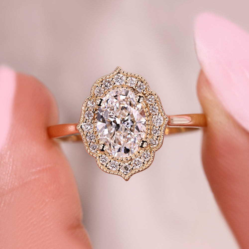 Oval lab grown diamond ring with round halo setting.