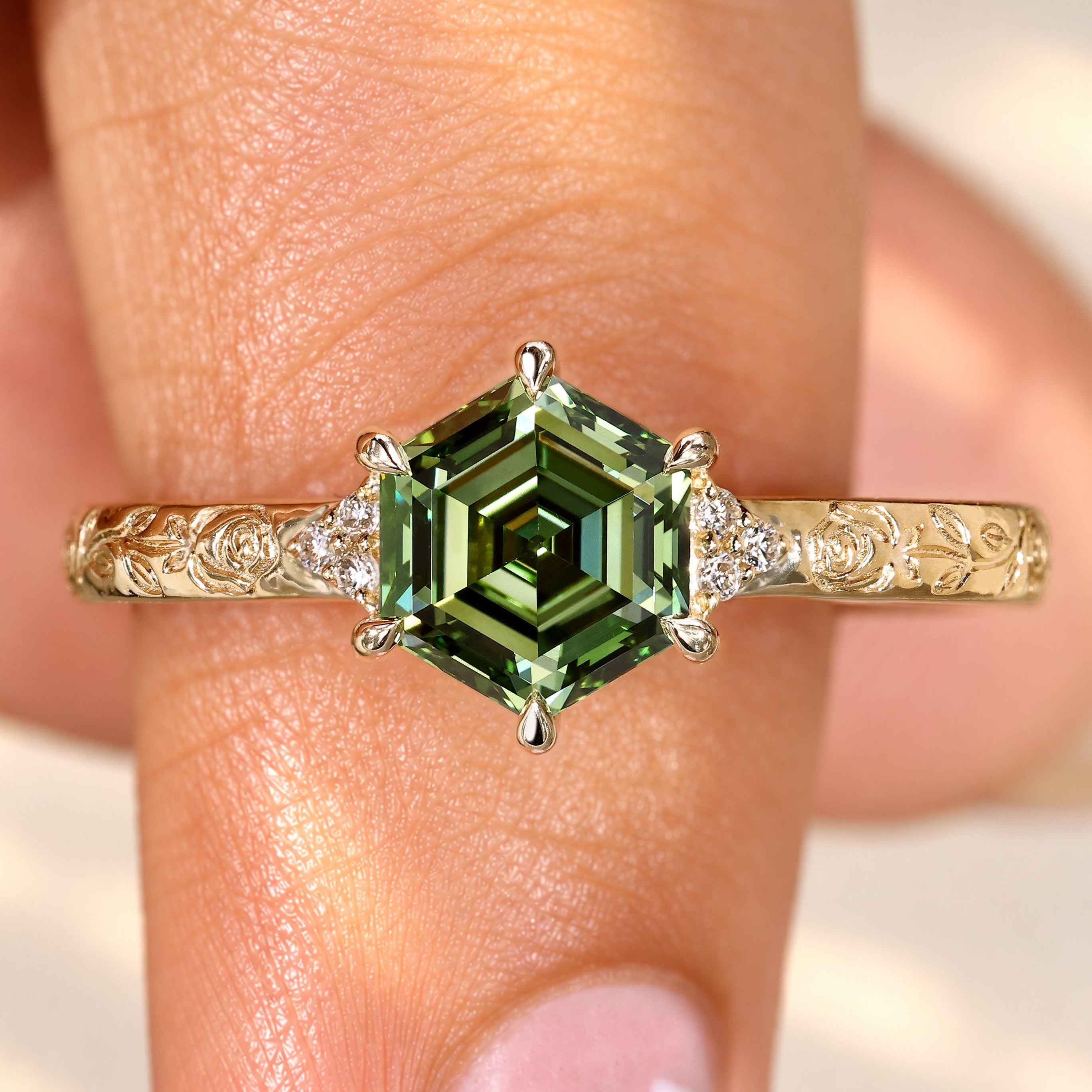 Hexagon diamond ring with rose design engraving.
