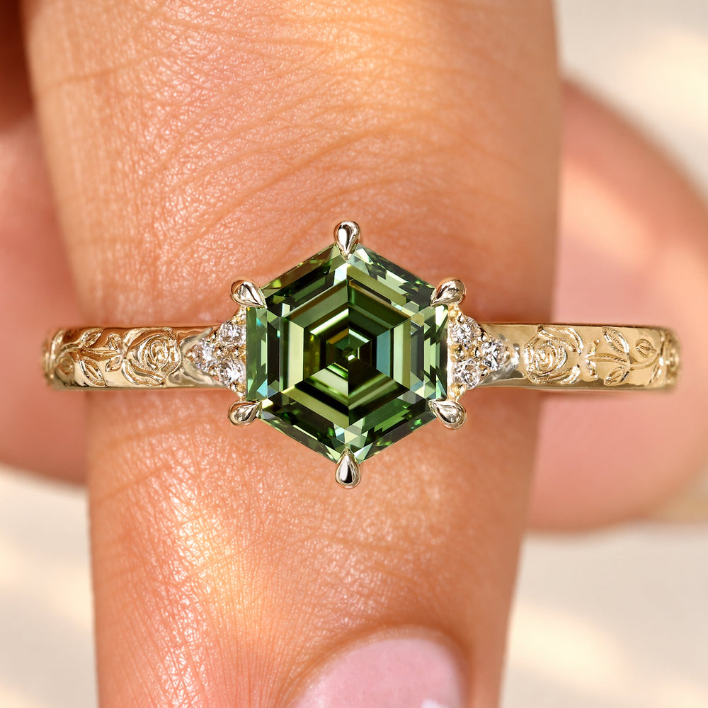 Hexagon diamond ring with rose design engraving.
