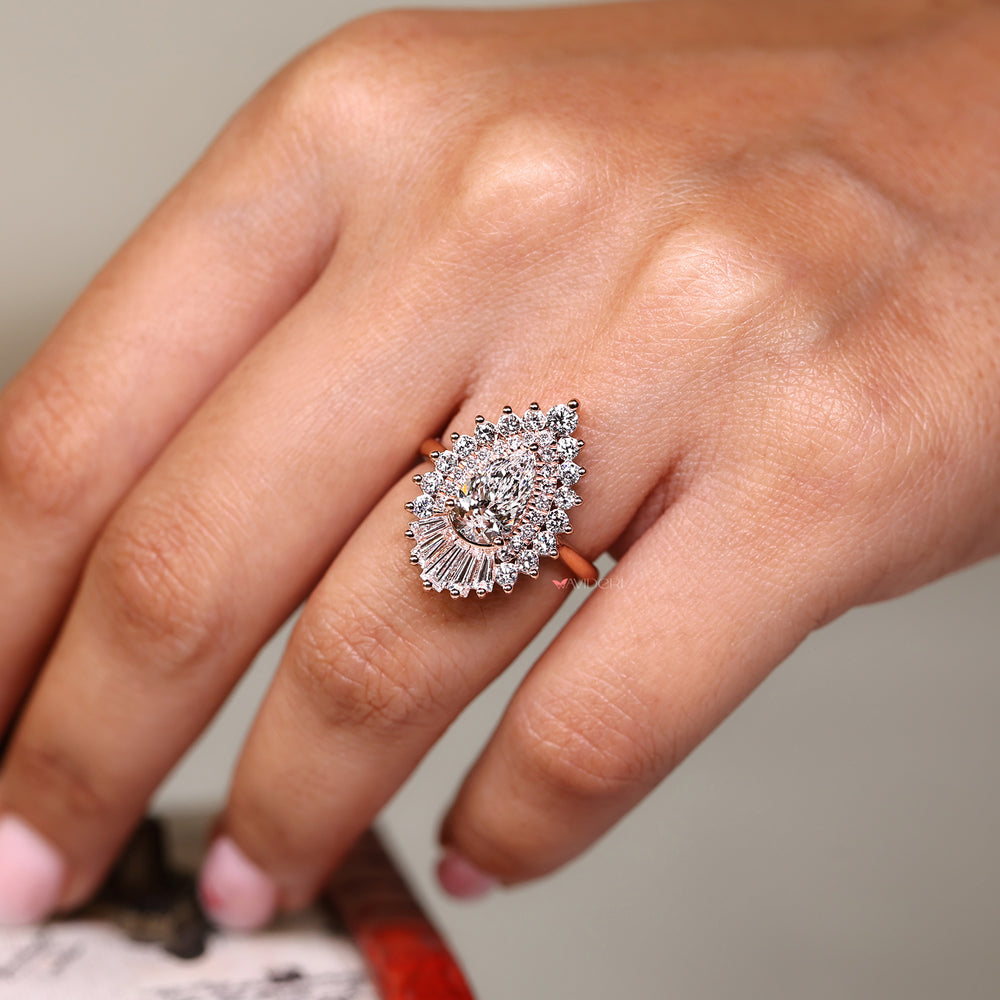 Lab grown pear cut diamond ring with cluster halo design.