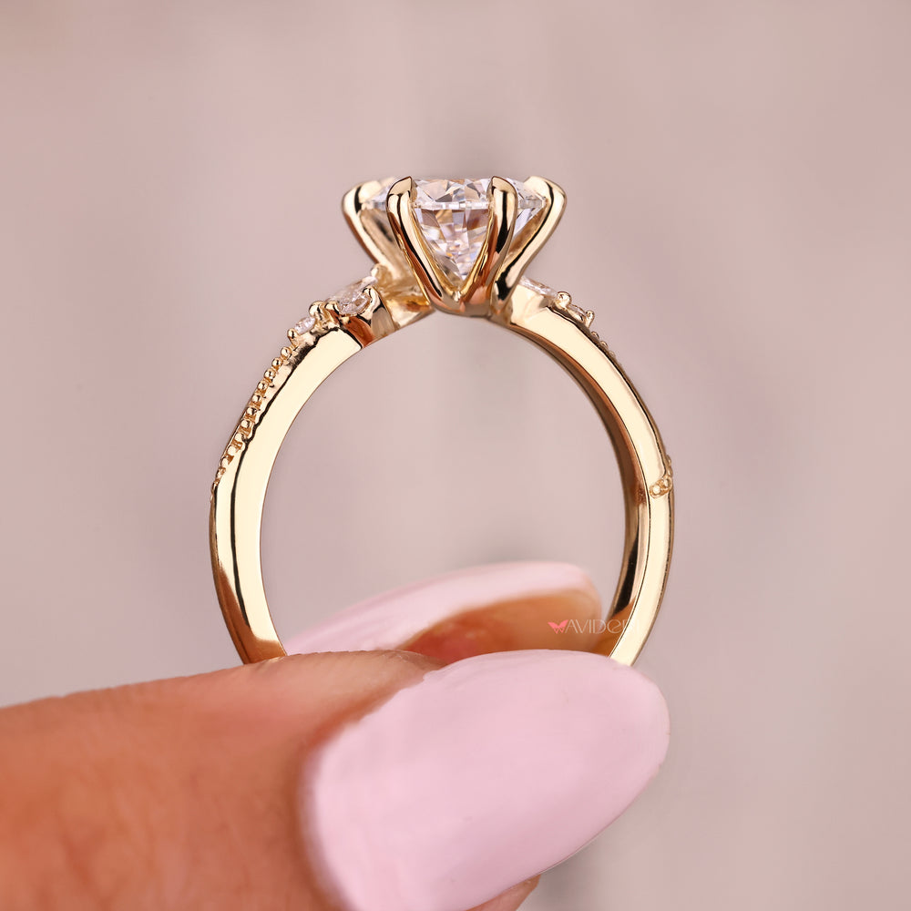 Avideri pear diamond ring with vintage milgrain design details
