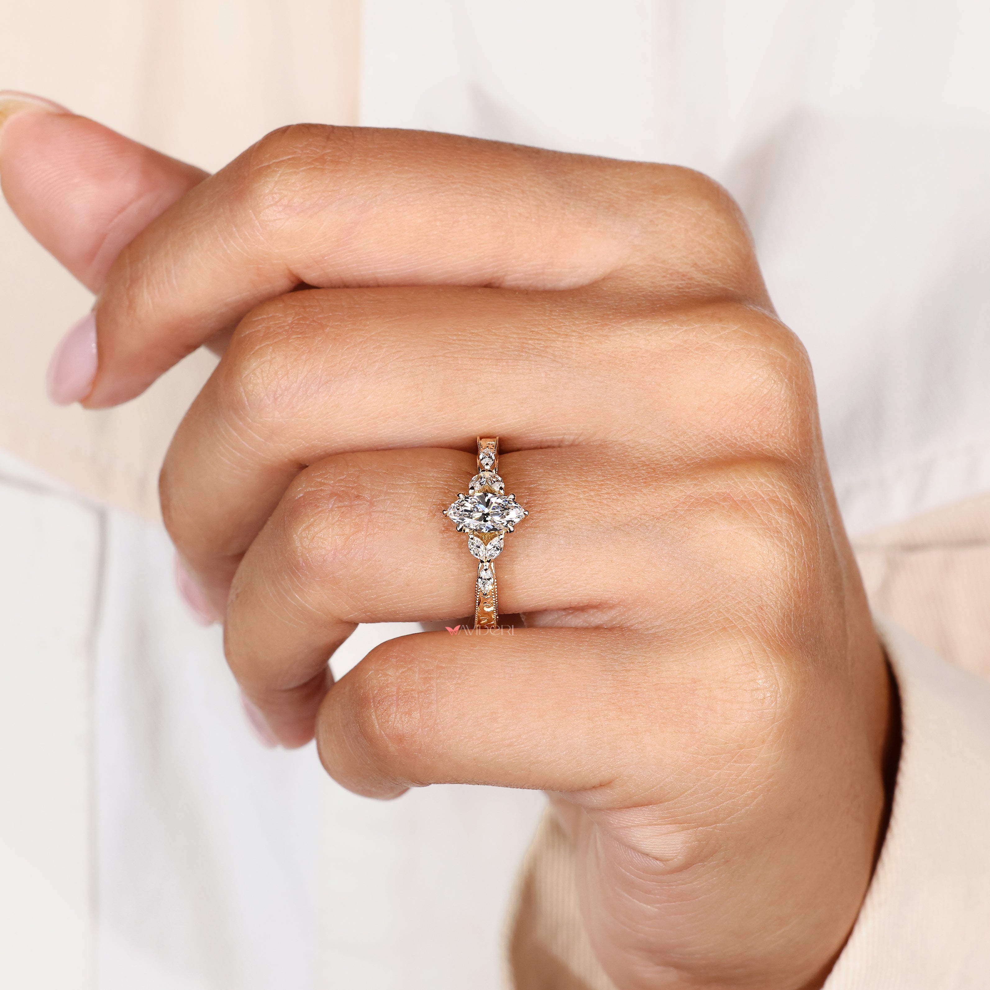 Small marquise side stone engagement ring.
