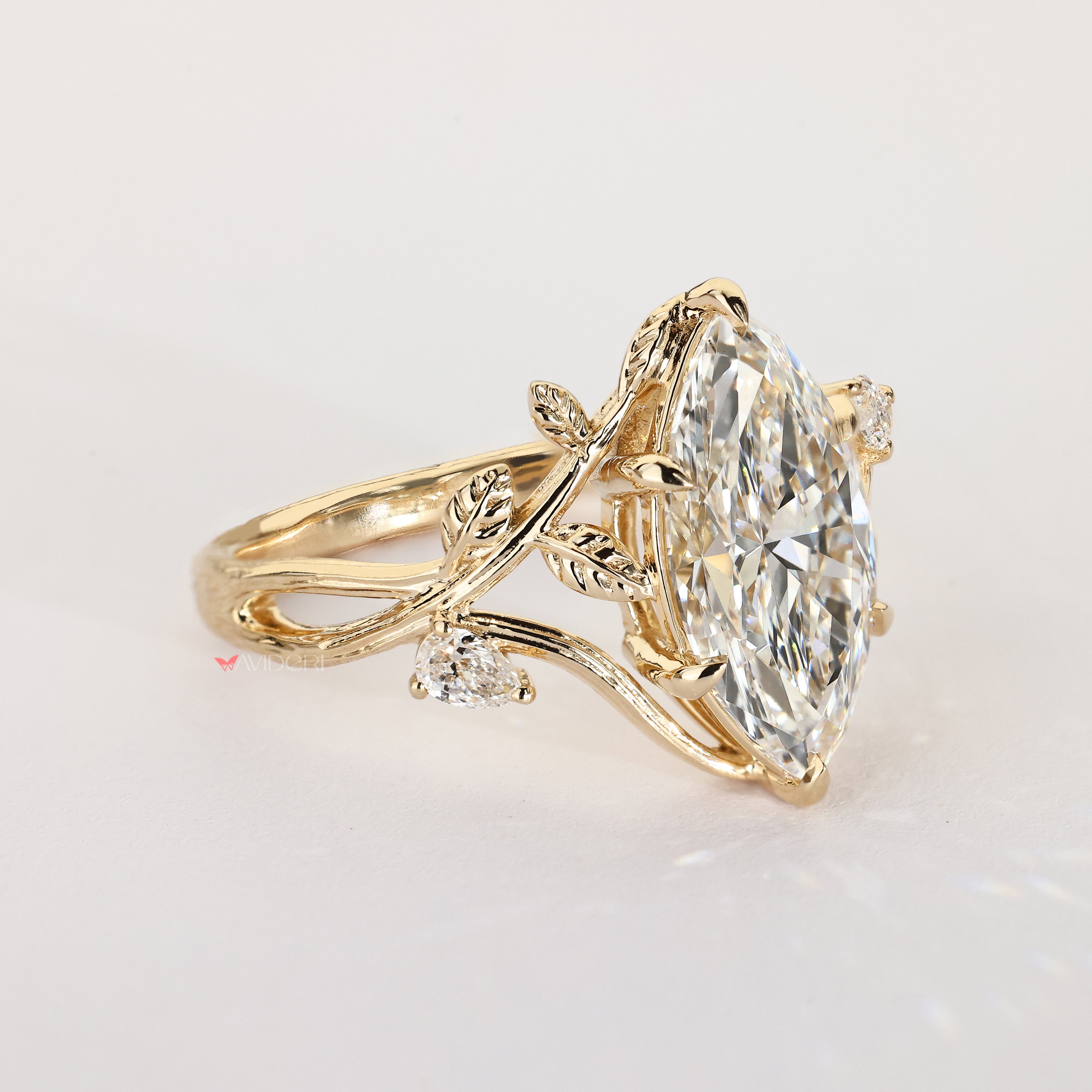 Nature inspired engagement ring with marquise center diamond design
