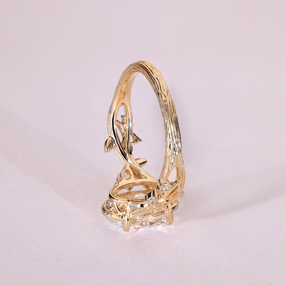 Oval center diamond ring with pear side stone accents
