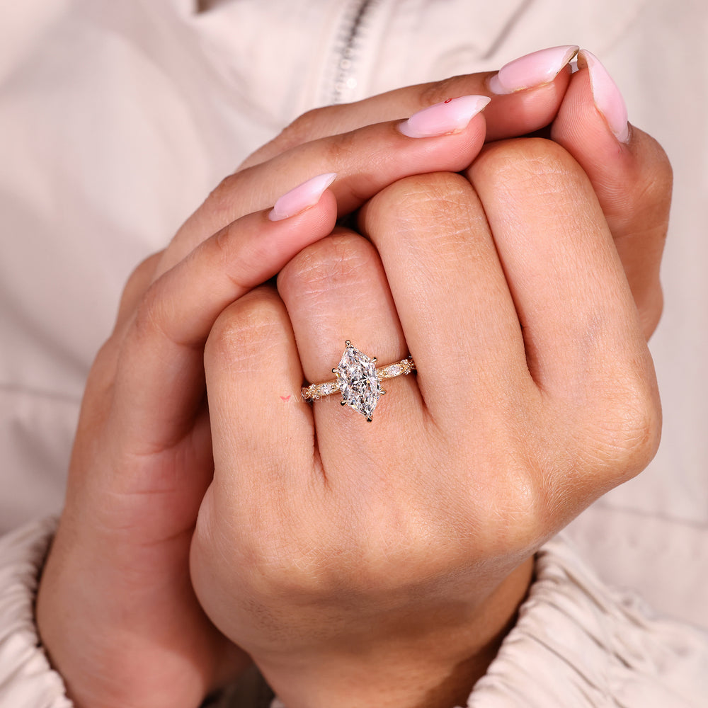 IGI certified dutch marquise diamond ring with side stones.