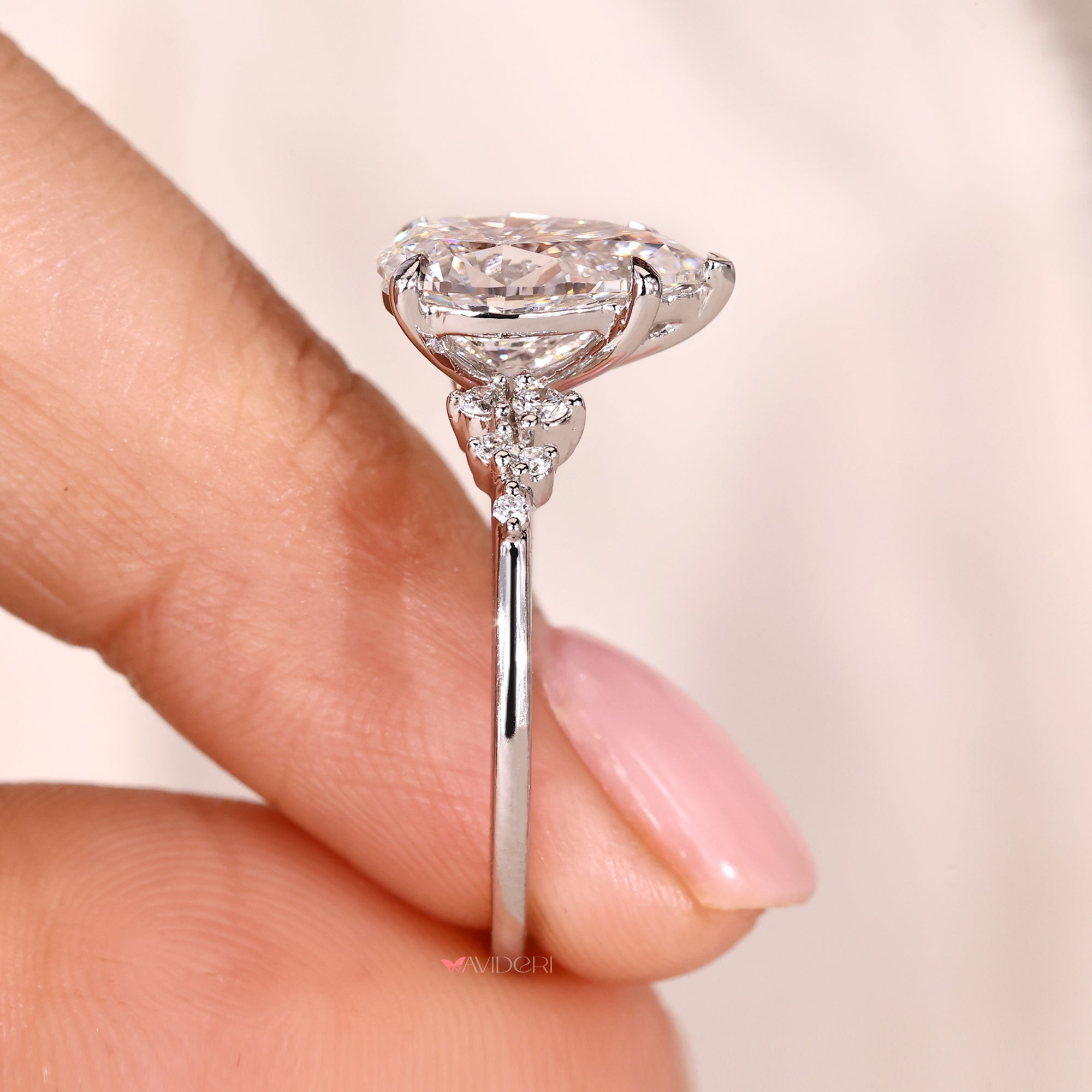 Muse setting in pear cut diamond engagement ring.