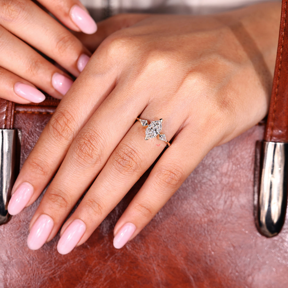 Dutch marquise diamond ring with kite cut side stones.
