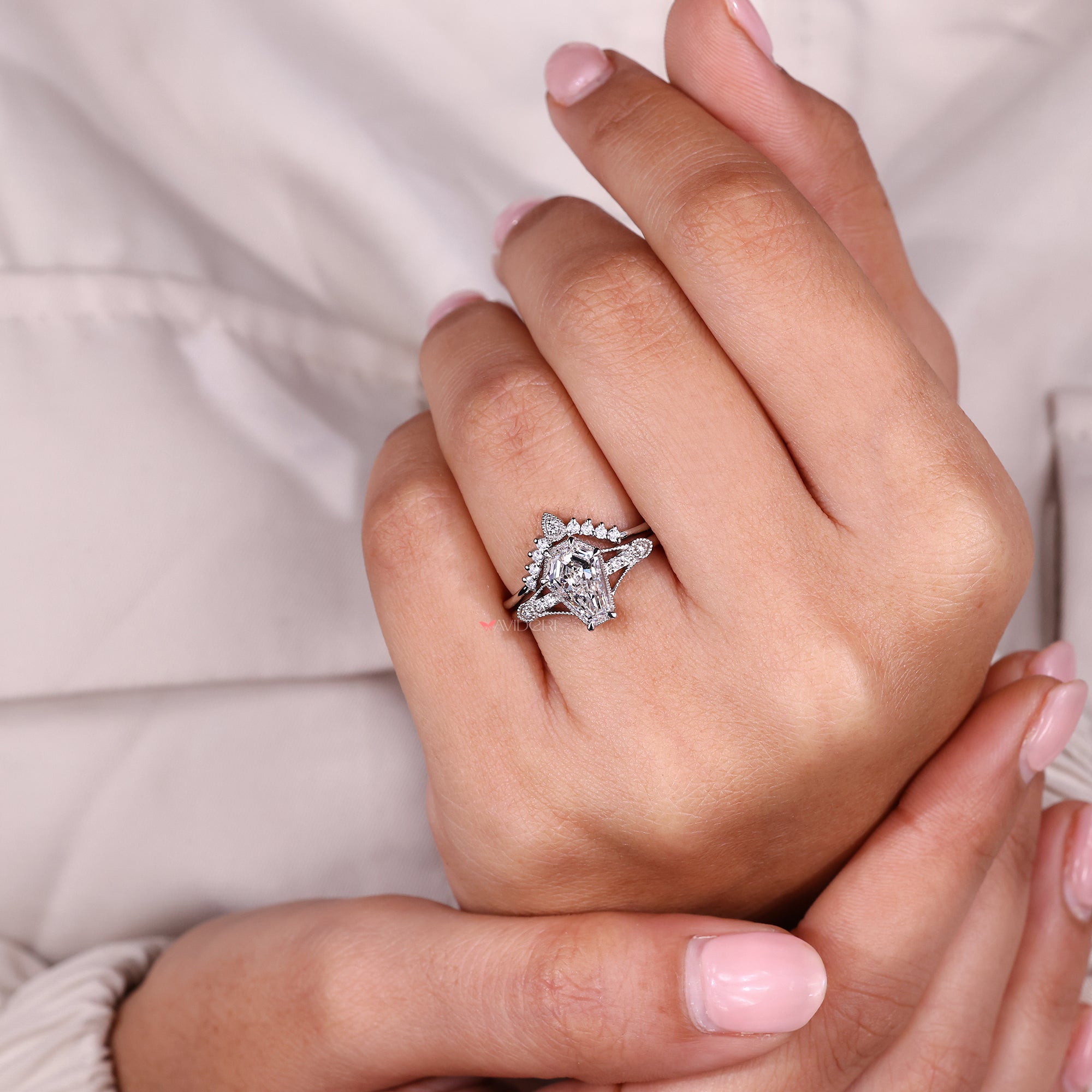 Diamond bridal set with a coffin cut center stone.