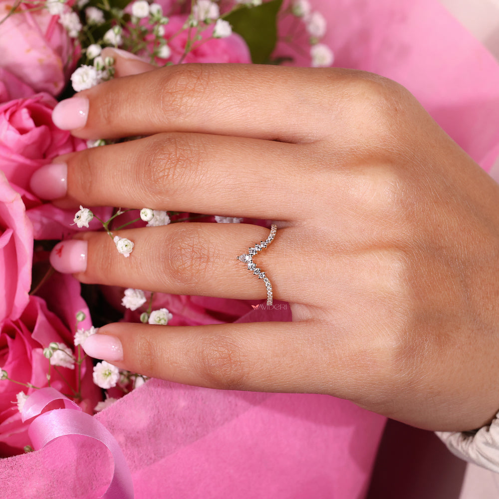 Pear cut wedding band in v shaped design.
