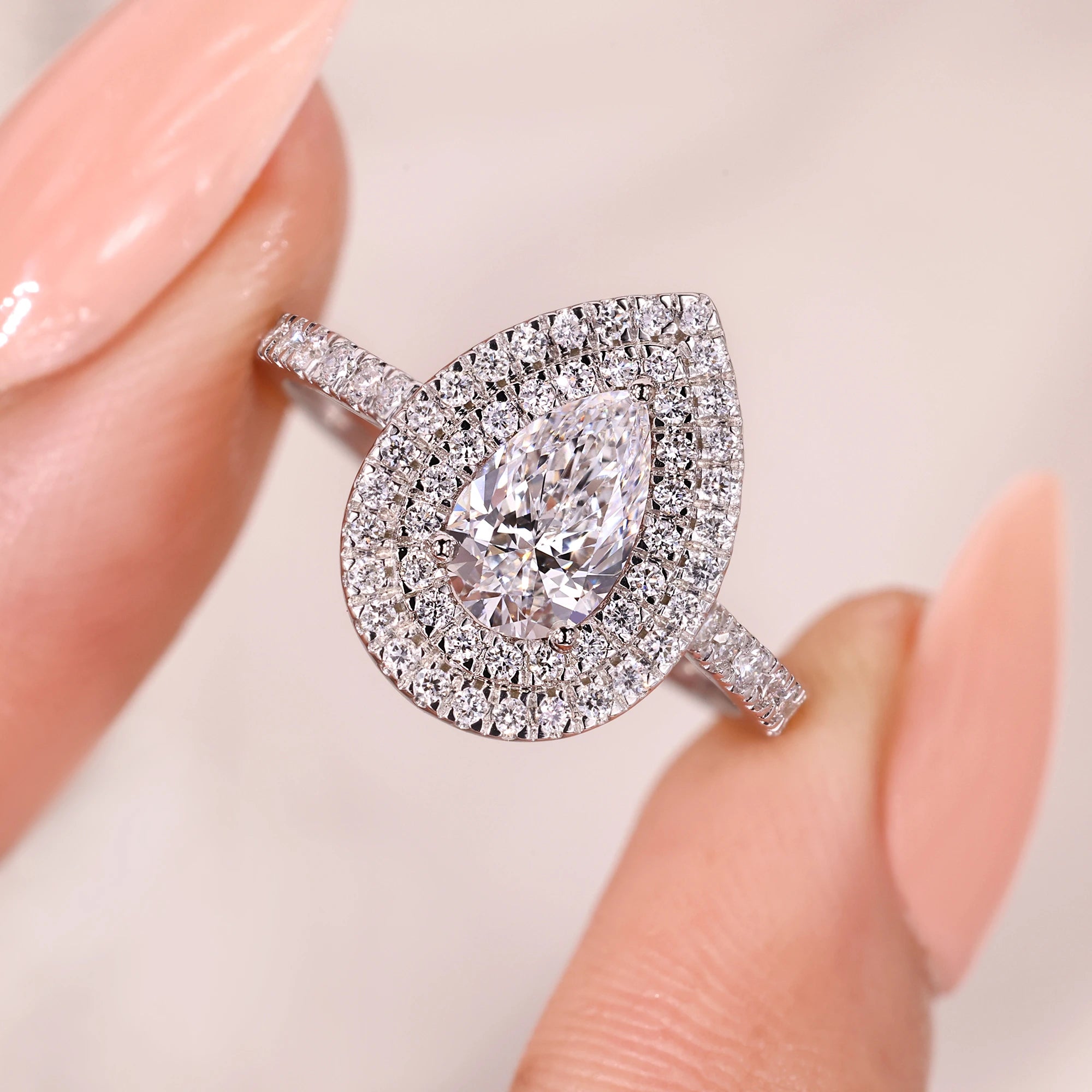 Classic double halo pear ring with unmatched brilliance.